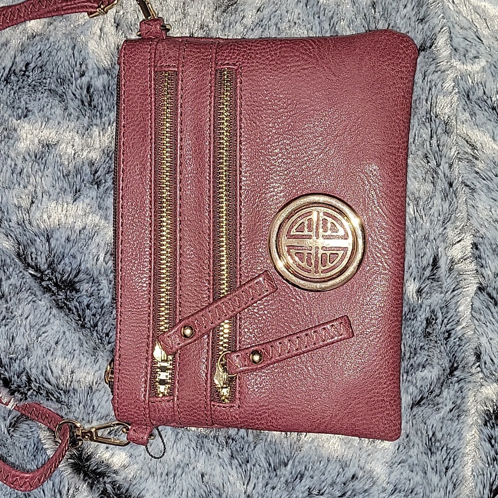 Wine color crossbody purse.